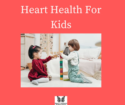 Picture of two toddlers sitting down on the floor and building a tower of blocks. 
Heart Health For Kids